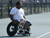 A man in a wheelchair prepares to play tennis