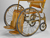 A wood-framed and wicker-backed wheelchair